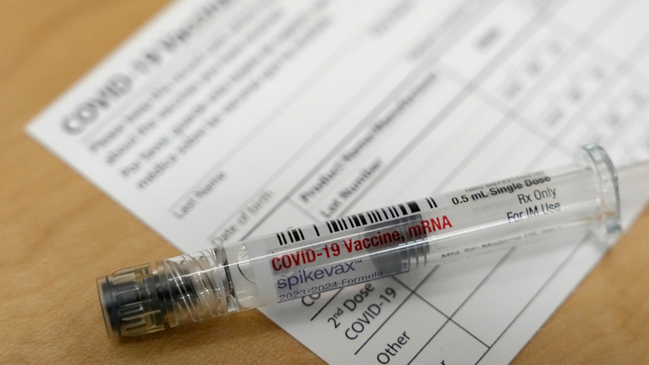 FILE - A Moderna Spikevax COVID-19 vaccine is seen at a drugstore in Cypress, Texas on Wednesday, Sept. 20, 2023. Since the Centers for Disease Control and Prevention signed off on them for ages 6 months and up in September 2023, people seeking the newest COVID-19 vaccine are running into high demand, insurance headaches and supply delays coast to coast. (Melissa Phillip/Houston Chronicle via AP, File)