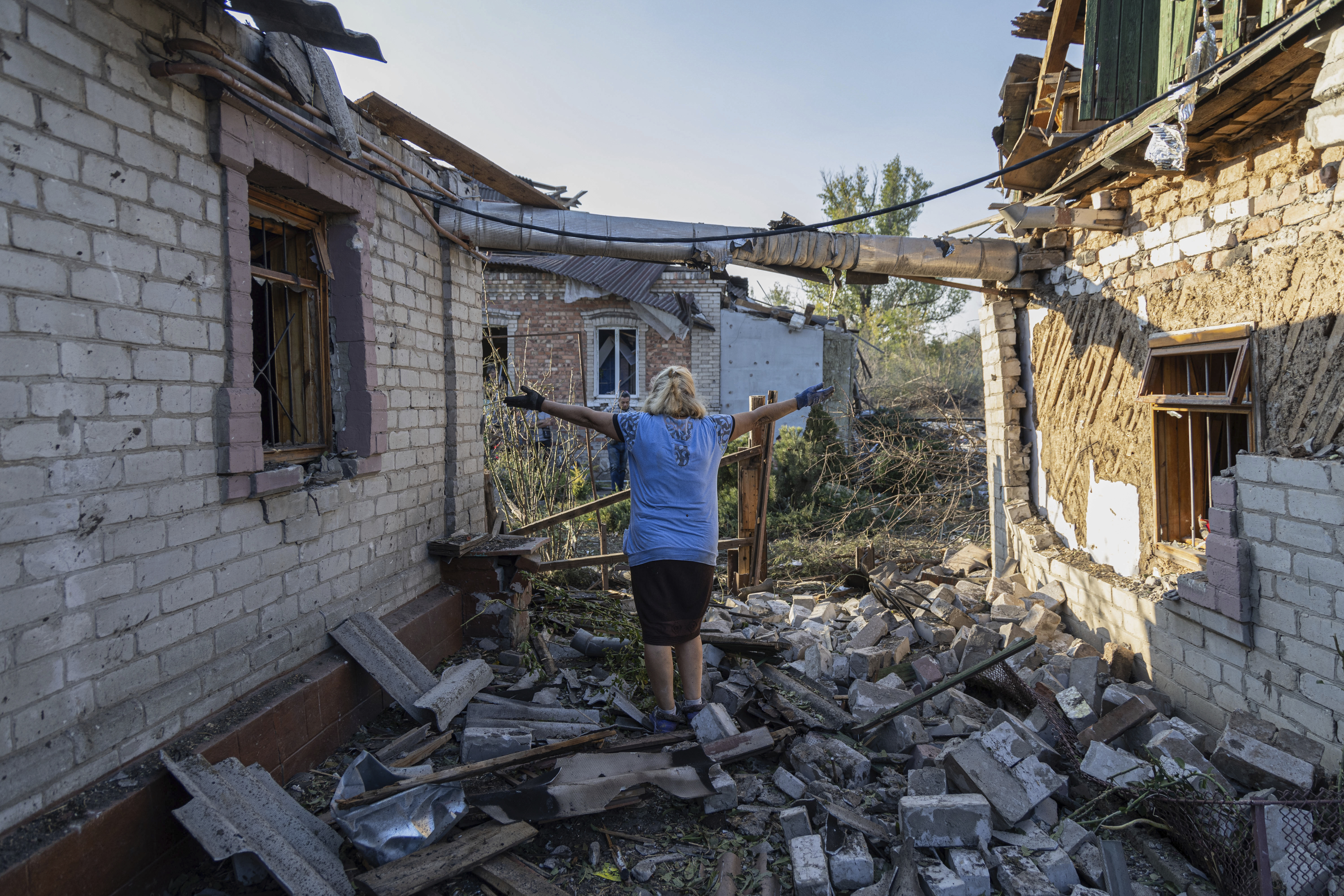 Olena Kononenko, 61 reacts near her damaged house after Russian rocket attack in Kostiantynivka, Donetsk region, Ukraine, Wednesday, September 27, 2023. (AP Photo/Alex Babenko)