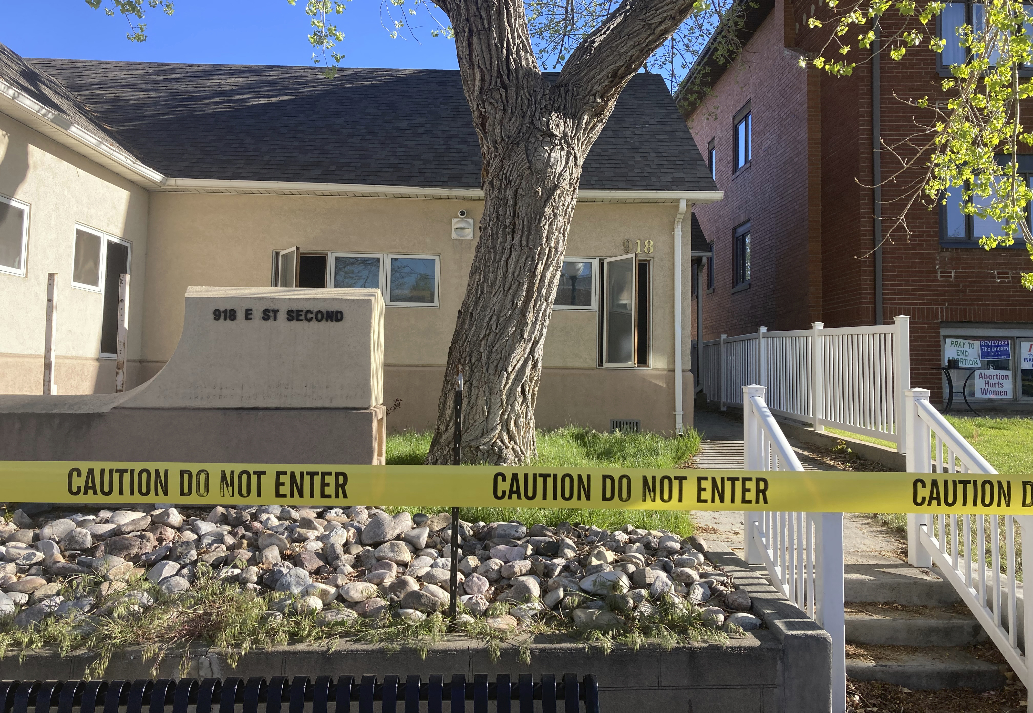 FILE - The fire-damaged Wellspring Health Access clinic is cordoned by tape, May 25, 2022, in Casper, Wyo. Lorna Roxanne Green, who says anxiety and nightmares led her to set fire to Wyoming’s only full-service abortion clinic is scheduled to be sentenced Thursday, Sept. 28, 2023. (AP Photo/Mead Gruver, File)