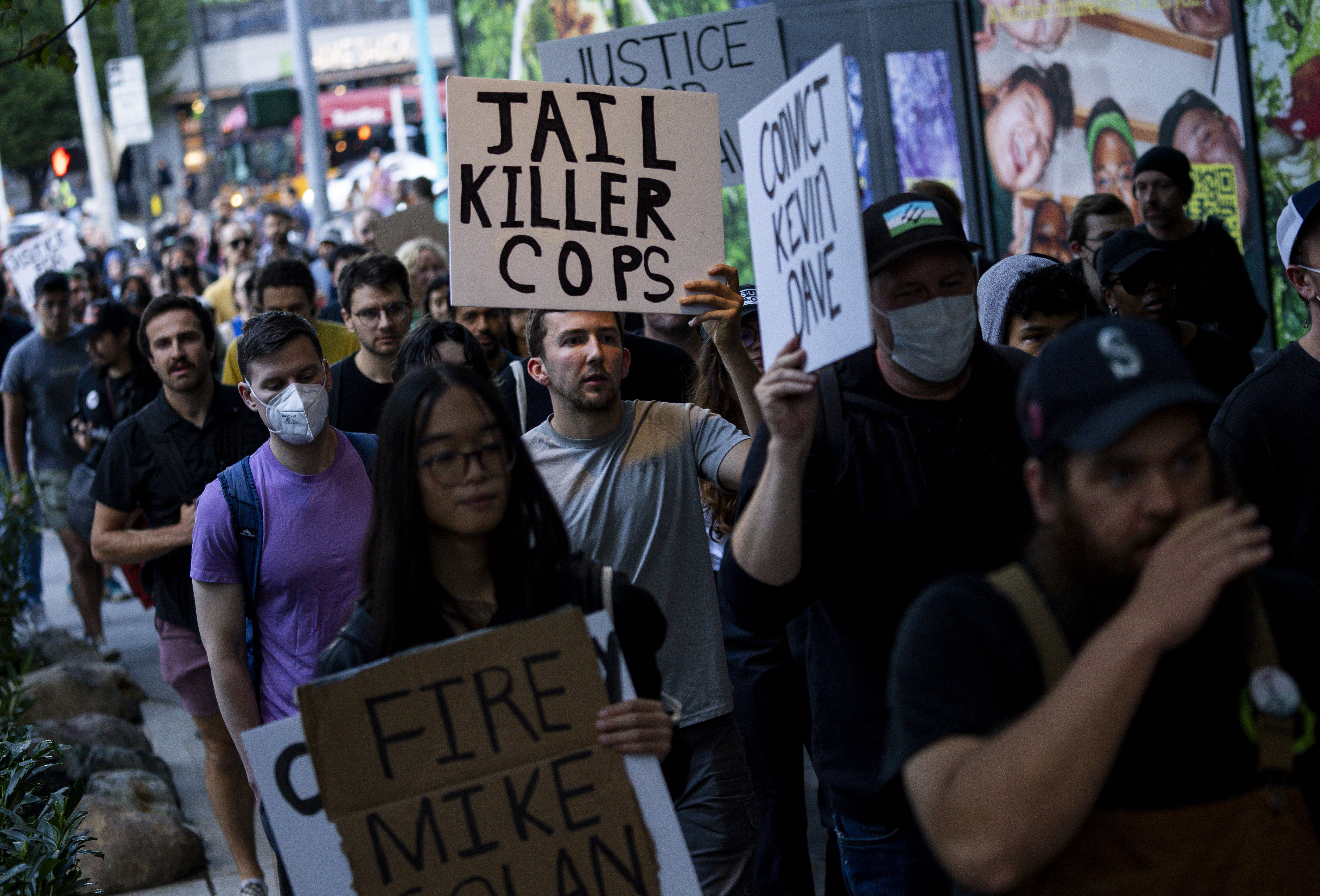 FILE - Protesters march through downtown Seattle after body camera footage was released of a Seattle police officer joking about the death of Jaahnavi Kandula, a 23-year-old woman hit and killed in January by officer Kevin Dave in a police cruiser, Sept. 14, 2023, in Seattle. A Seattle police officer and union leader under investigation for laughing and making callous remarks about the death of Kandula, from India, who was struck by a police SUV, has been taken off patrol duty, police said Thursday, Sept. 28. (AP Photo/Lindsey Wasson, File)